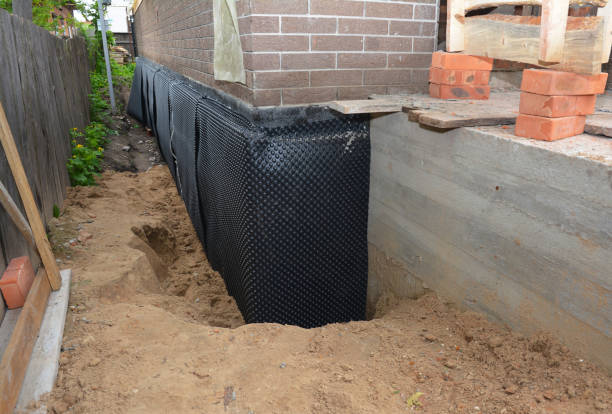 SJ Waterproofing Pros technician performing targeted Foundation Crack Repair assessment in Oakford, IN